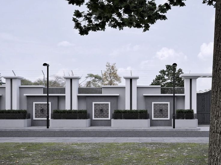 Modern grey fence with pillars, planters and brick panels