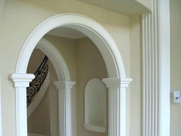 White arched doorway with fluted columns